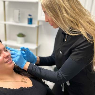 Woman receiving dermal filler treatment at StarBella Spa